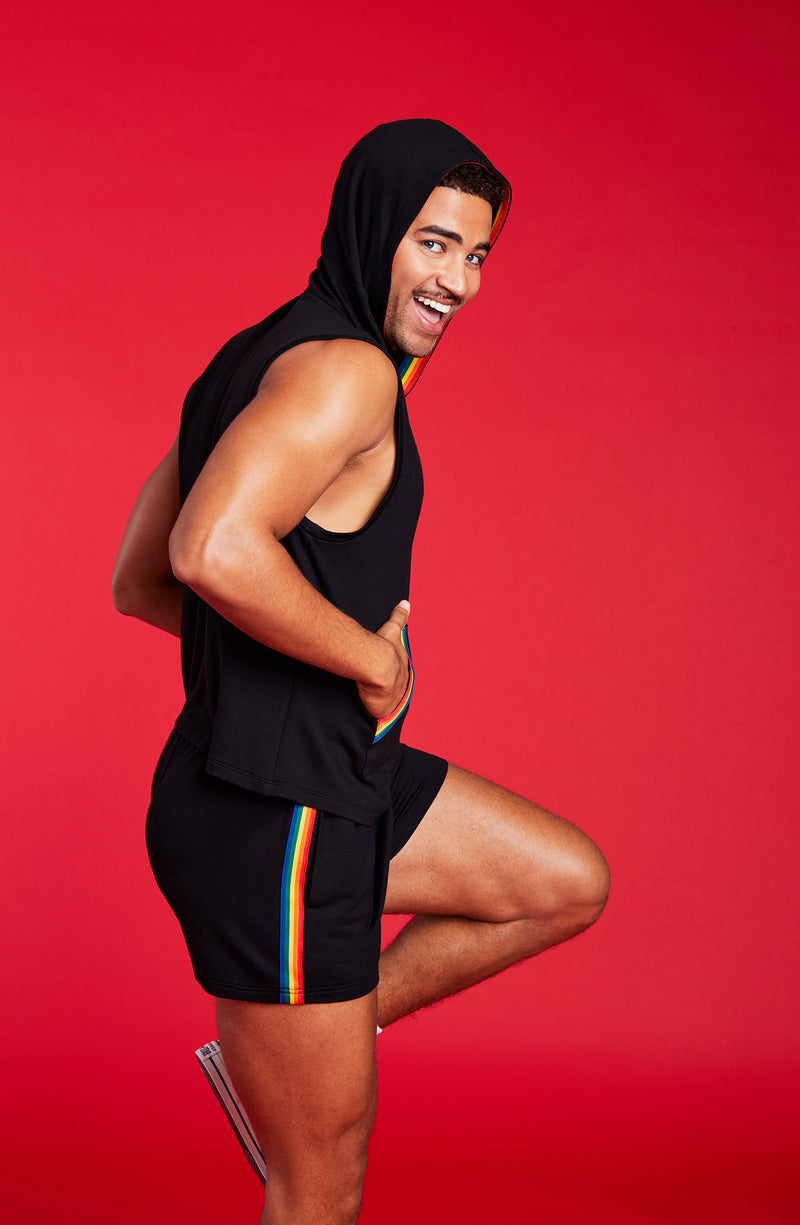 A man wearing sleeveless black hoodie