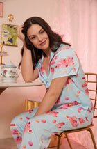 A lady wearing blue short sleeve madison pj set with sweet dreams print.
