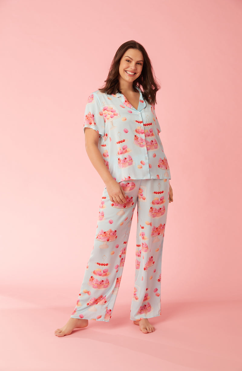A lady wearing blue short sleeve madison pj set with sweet dreams print.