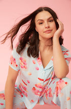 A lady wearing blue short sleeve madison pj set with sweet dreams print.