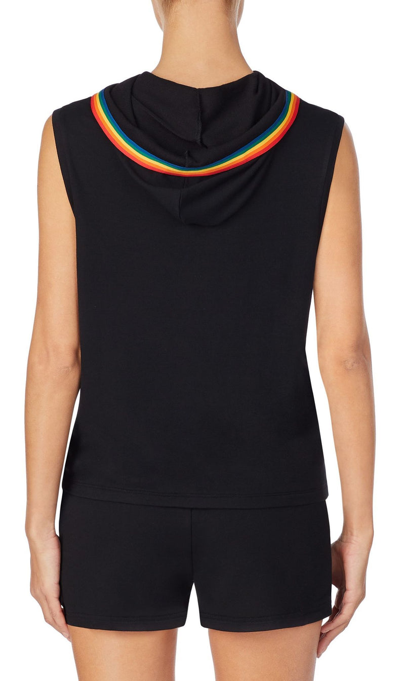 A girl wearing sleeveless black hoodie